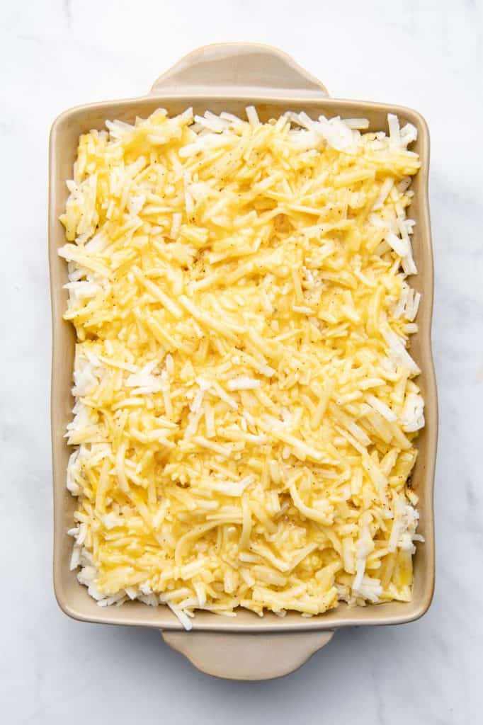 A breakfast casserole shot overhead and ready to go in the oven