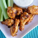 Honey Garlic Sriracha Wings - JoanieSimon.com - a spicy game day snack you can make in the oven
