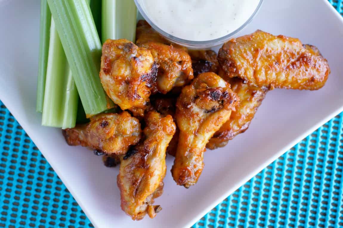 Honey Garlic Sriracha Wings - JoanieSimon.com - a spicy game day snack you can make in the oven
