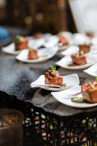 Crispy Pork Belly Bites on white plates