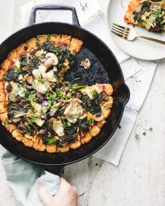 Skillet of tater tots with pizza toppings