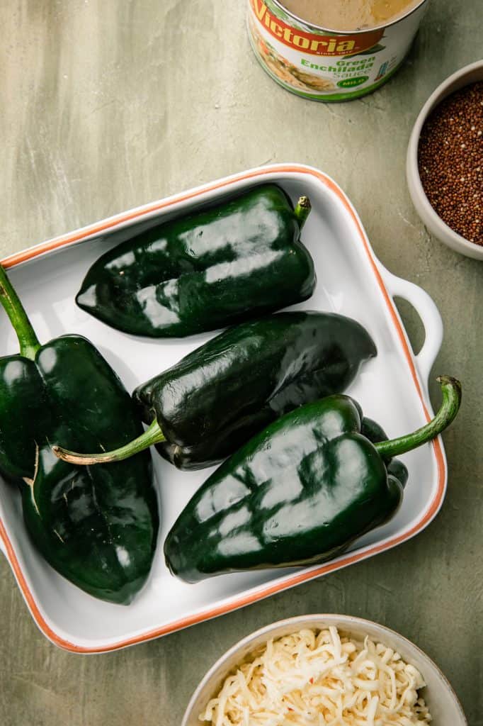 ingredients for chicken stuffed poblano peppers with cheese, quinoa and green salsa