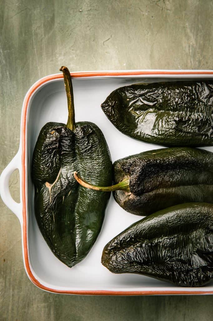 a pan of roasted poblano peppers