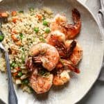 overhead view of a plate of shrimp with fried rice