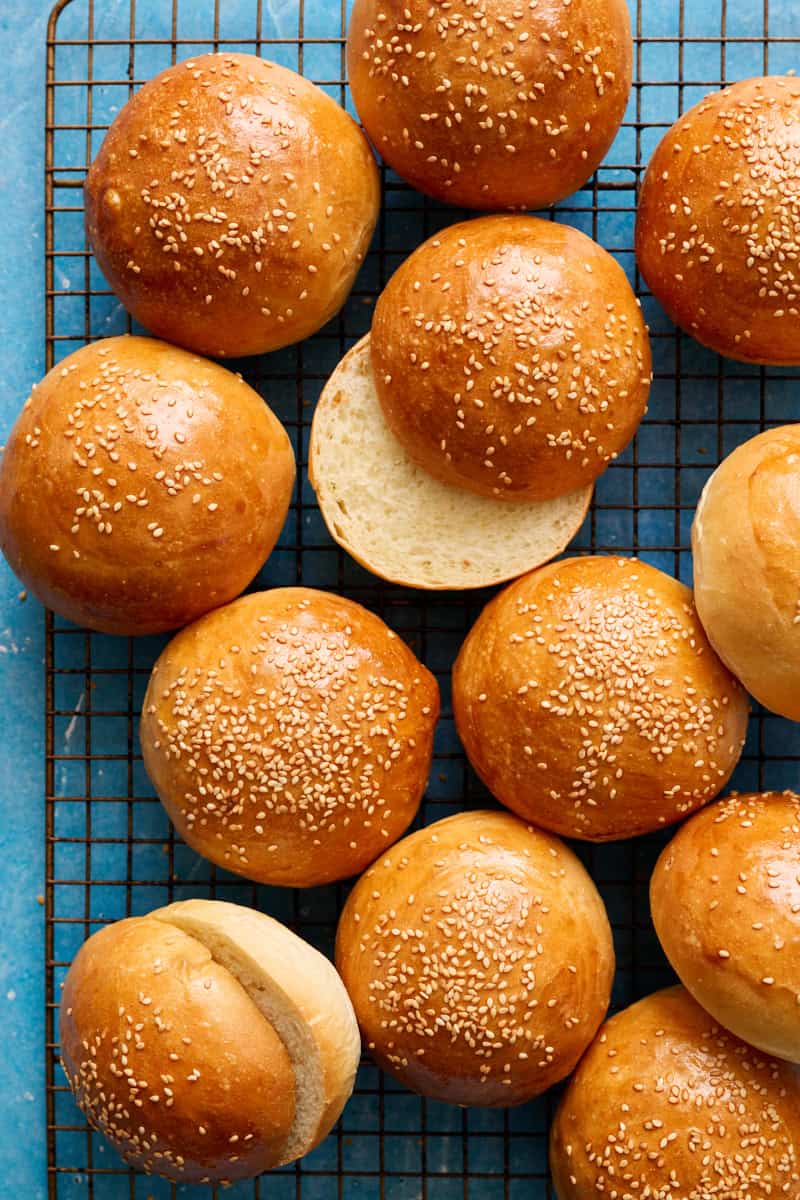 overhead of hamburger buns on a cooling rack