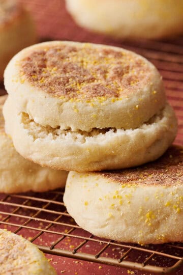 a stack of english muffins on a cooling rack