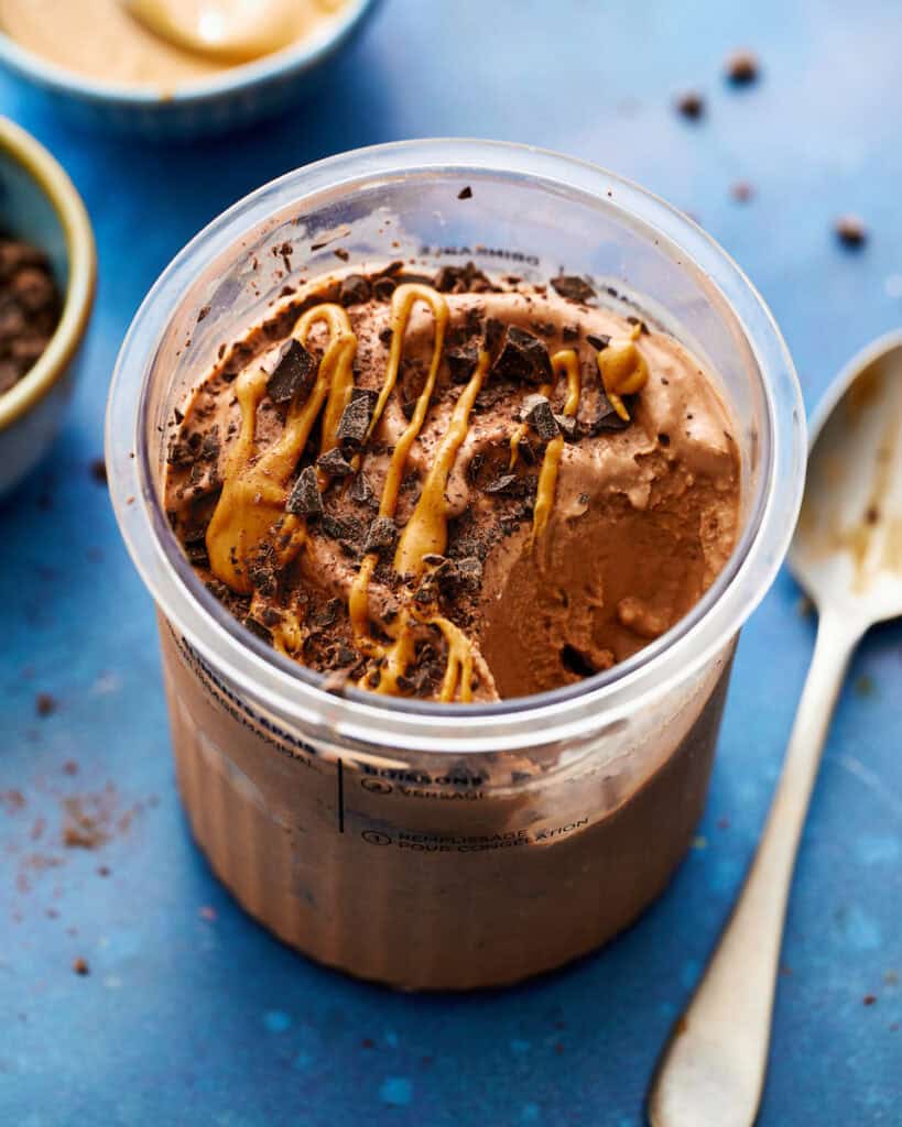 a container of protein ice cream with a spoon