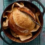 sourdough loaf in a dutch oven after being baked