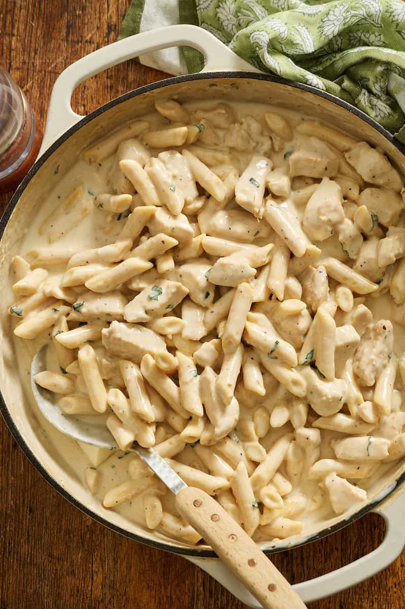 cottage cheese alfredo pasta with chicken in a skillet ready to serve