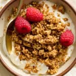 buckwheat granola on top of yogurt with berries