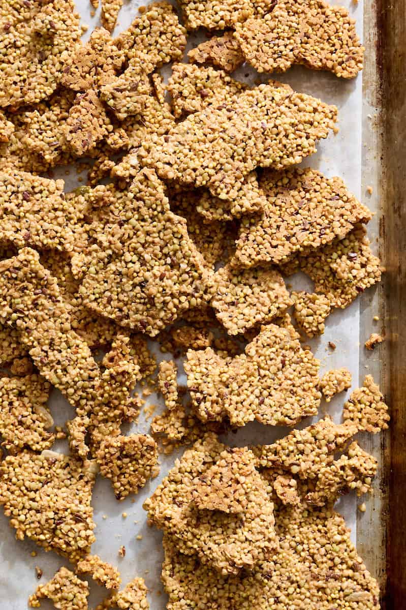 big sheet of granola being broken up