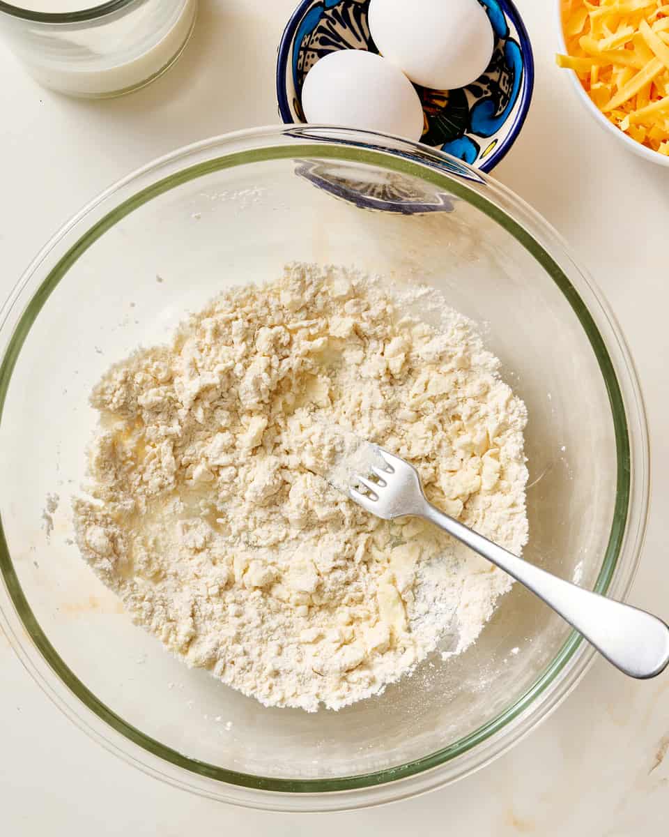 flour, butter, baking powder and salt combined in a bowl