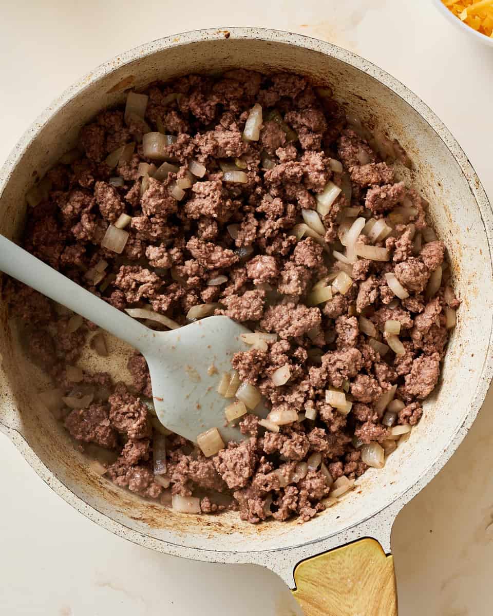 browning the meat and onions in a skillet