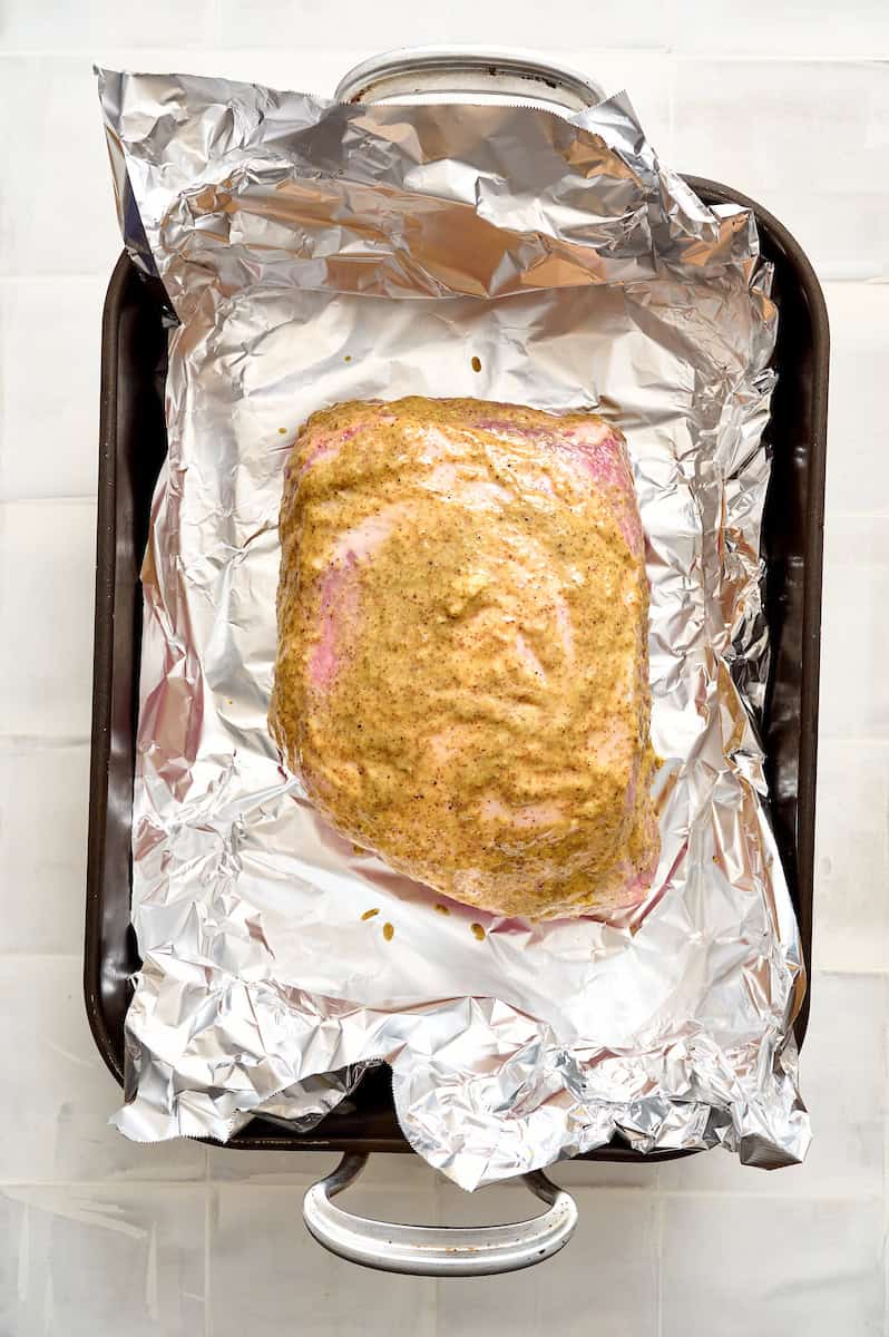 the pork roast rubbed with mustard rub