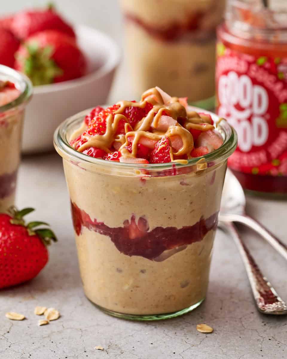 pb&j overnight oats with protein topped with berries and peanut butter