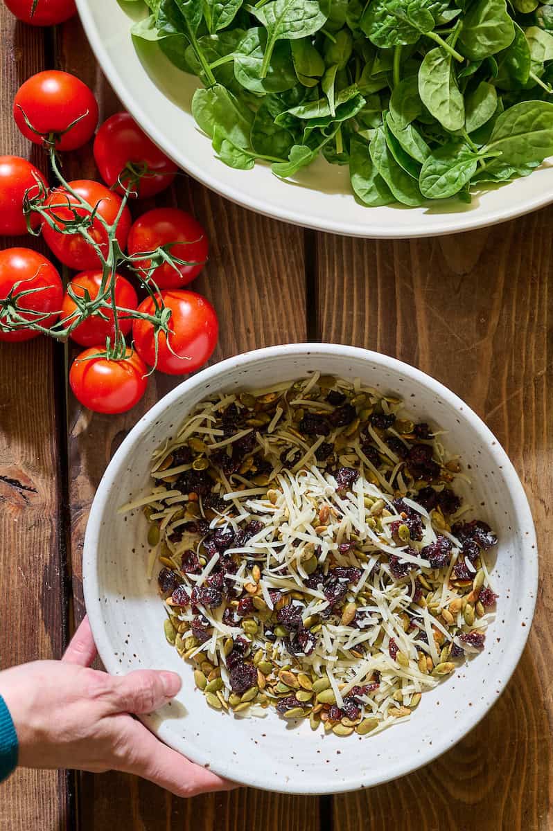 tossed together toasted pepitas, cranberries and parmesan for topping