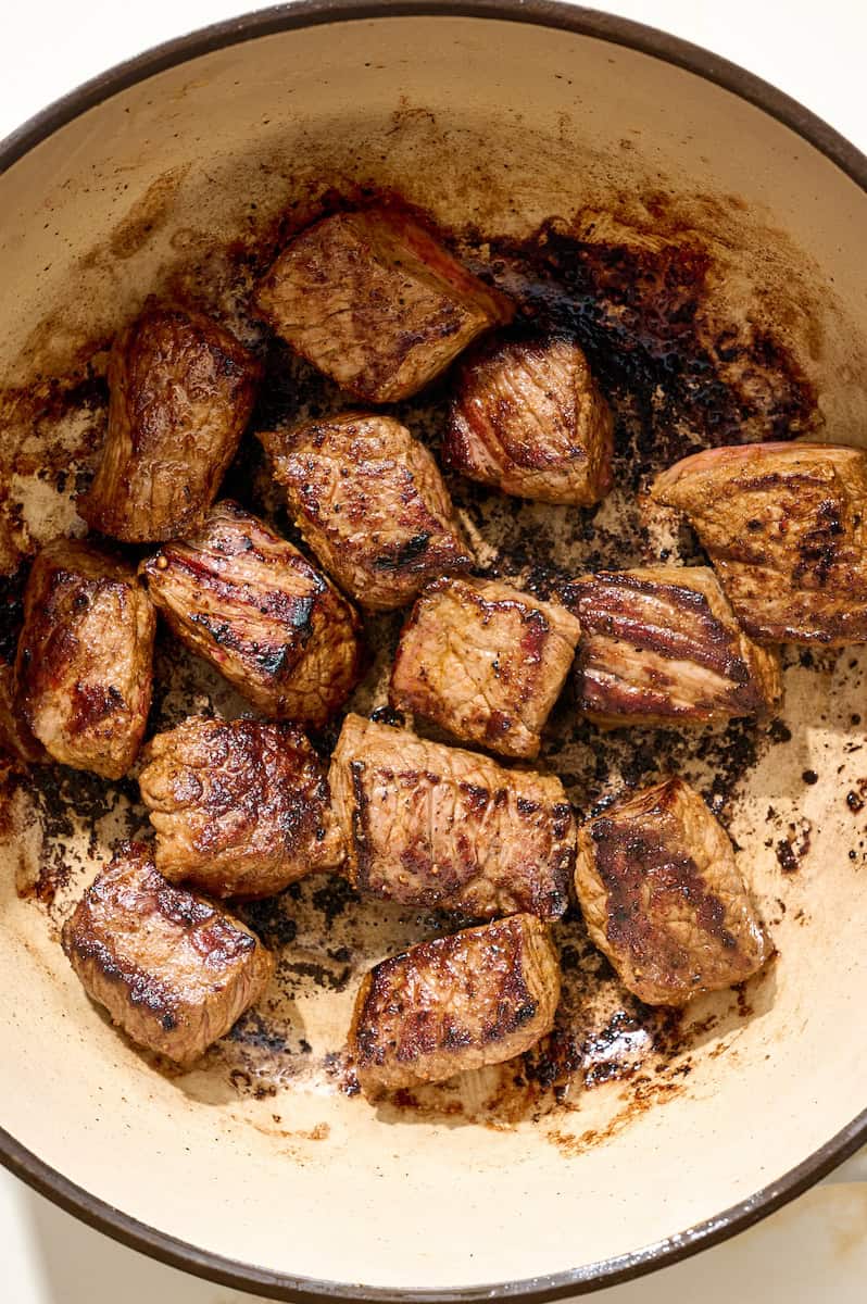 searing beef in a heavy-bottomed pot