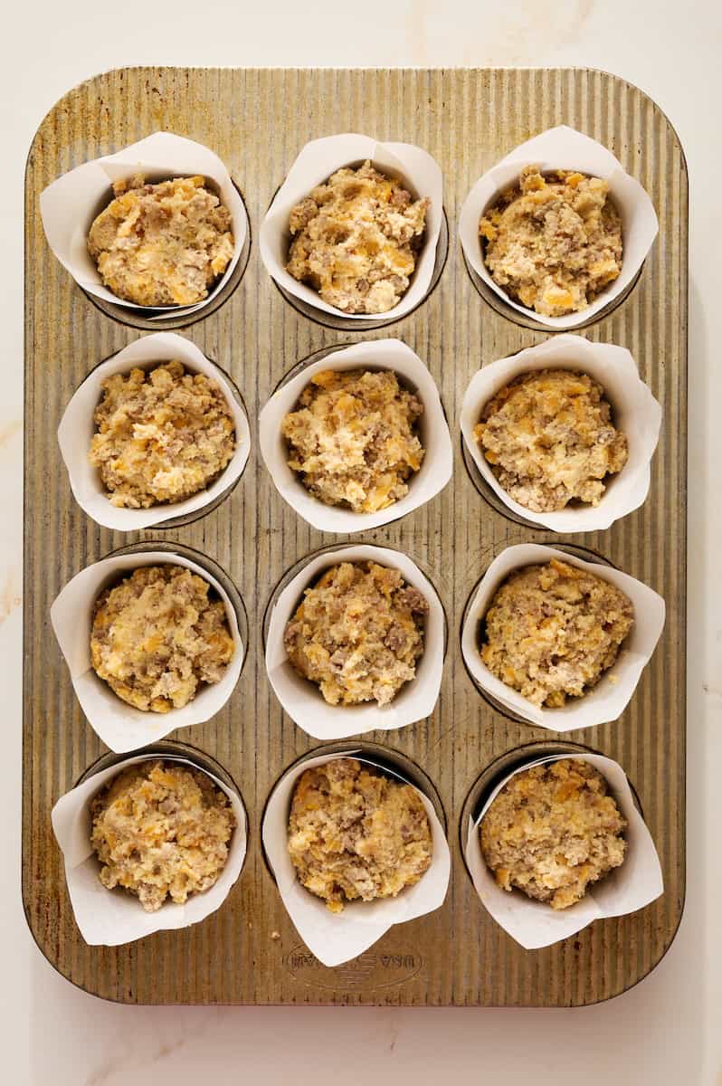 portioning batter into lined muffin tin