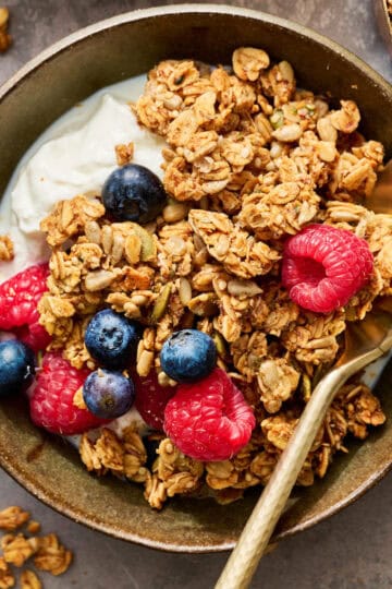 granola in a bowl with yogurt and fruit