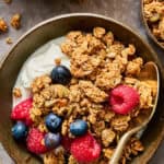 granola in a bowl with yogurt and fruit