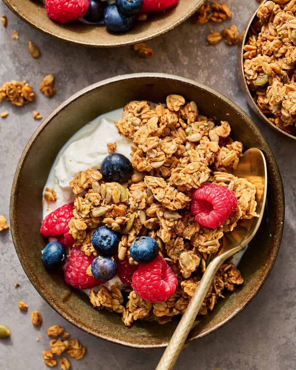 granola in a bowl with yogurt and fruit