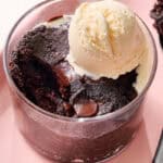 sugar free mug brownie with a bite taken out with ice cream on top