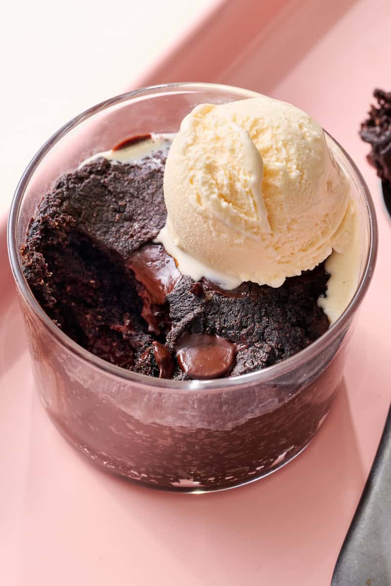 sugar free mug brownie with a bite taken out with ice cream on top