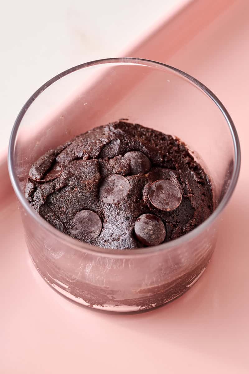 brownie batter in a cup before cooking