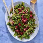 a bed of arugula topped with the beet mixture