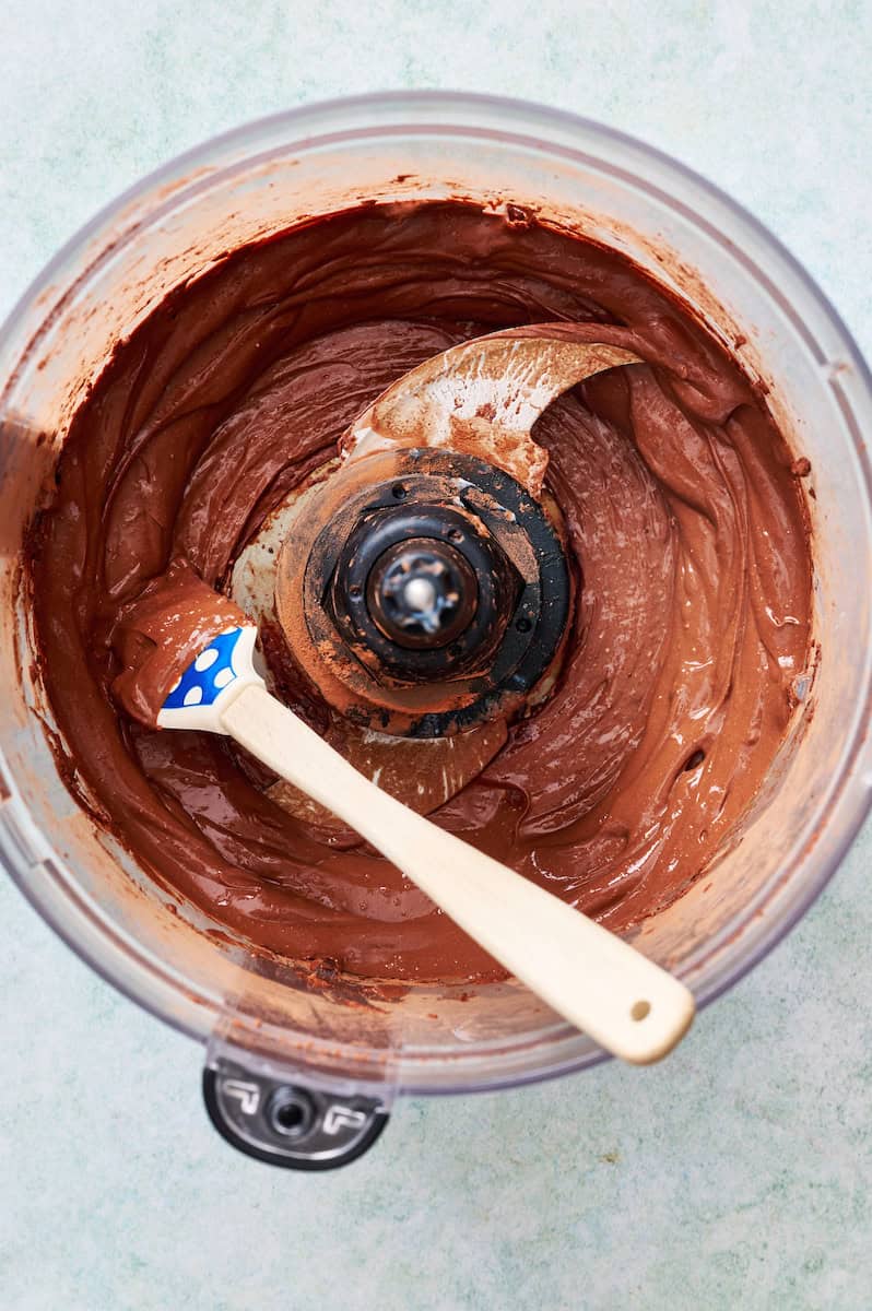 blending cocoa powder, cottage cheese and sweetener in a food processor