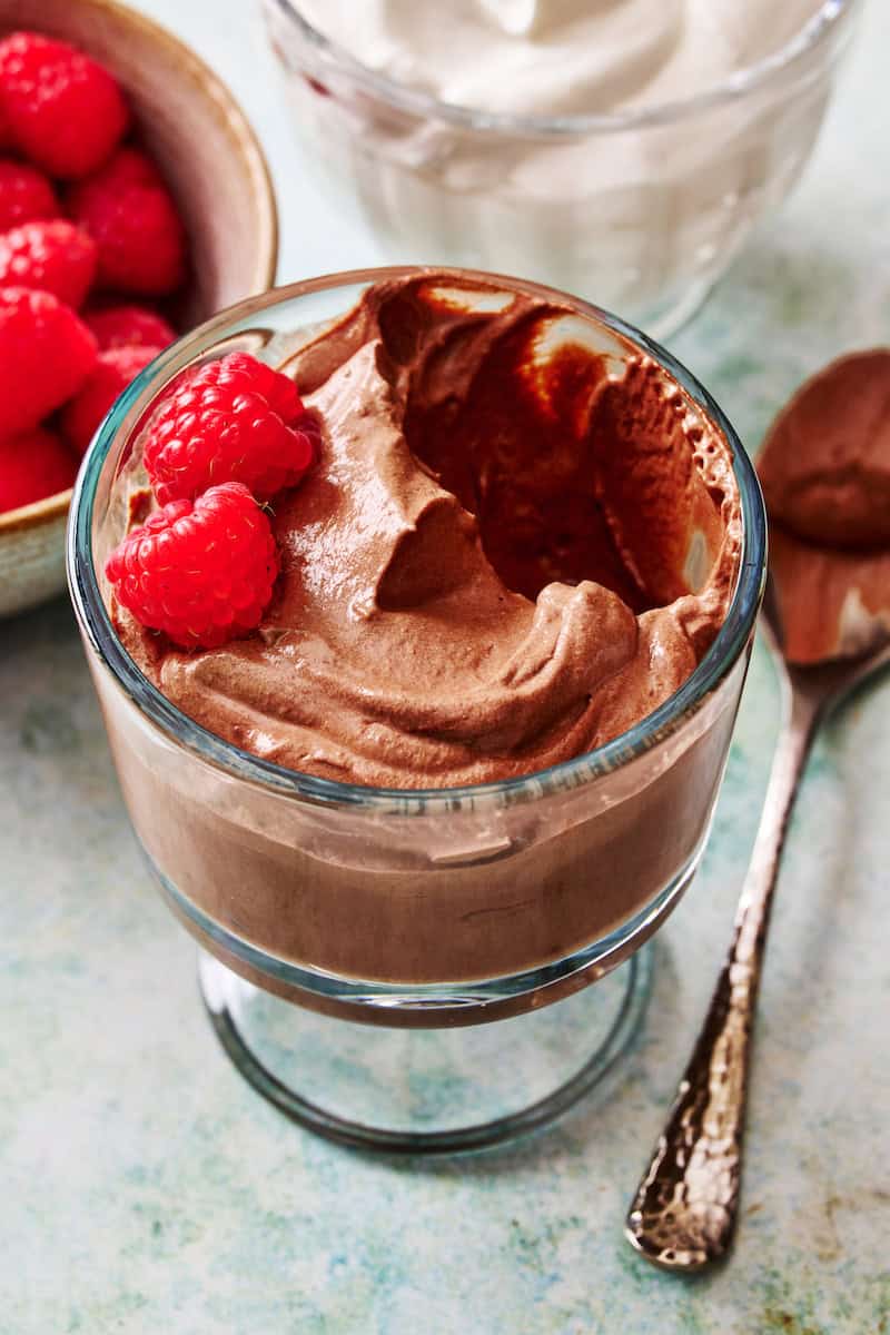 cottage cheese chocolate mousse in a glass with raspberries on the side