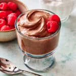 cottage cheese chocolate mousse in a glass with raspberries on the side